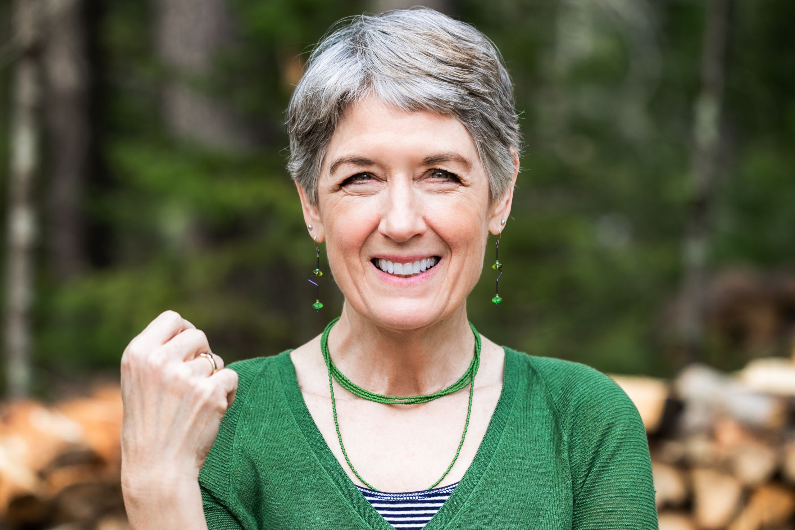 Headshot of a woman wearing a green shirt